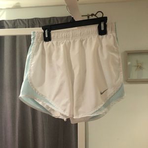 white and light blue nike athletic shorts